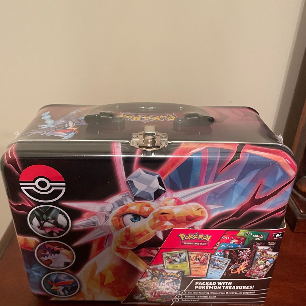 Pokemon Card Game Tin with Red and Black Design
